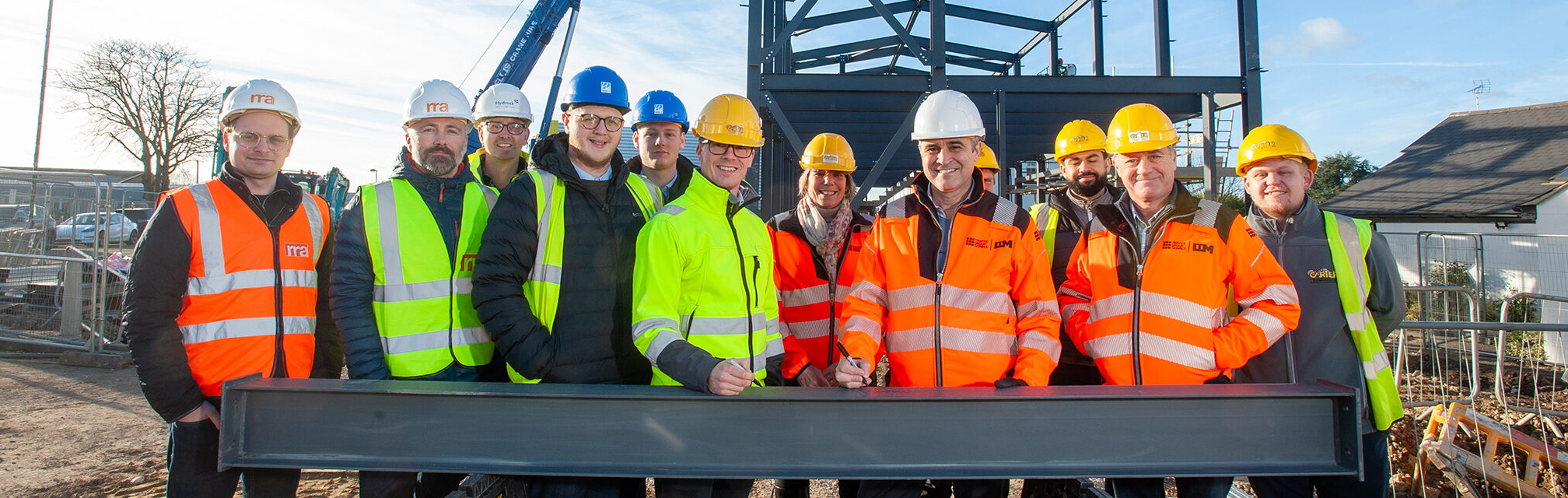 The Traffic Group marks expansion with a symbolic steel signing at its headquarters in Cheltenham